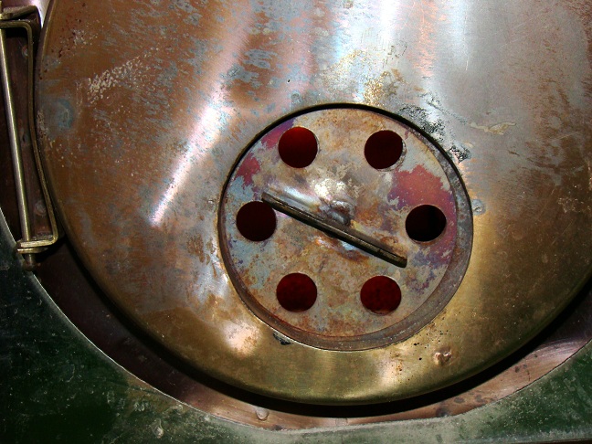 Регулировочный диск на дверце топки Сапфиры